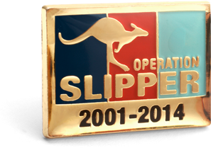The rectangular Operation Pin is showing the tri-service colours of navy blue, red and light blue in vertical stripes set in a Gold plate face with a leaping kangaroo in Gold and words Operation Slipper printed over. The dates 2001 - 2014 sit at the bottom of the lapel pin face.   